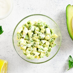 Avocado eggs salad in bowl
