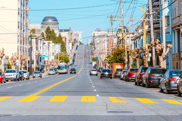 A street in the center of the city with a sloping road and a beautiful view of the downtown. San Francisco, USA - 17 Apr 2021