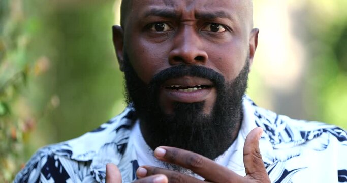 Black man SHOCK terror emotion. unbelief African person in DESPAIR