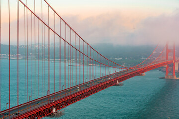 Amazing view of the famous Red Golden Gate Bridge and colorful sunset sky in San Francisco