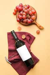 Composition with bottle of wine and ripe grapes on color background