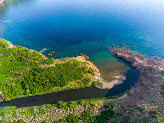 Rio Mannu outlet seen from above at sunset