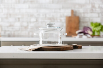 Stylish cooking pot on counter in kitchen