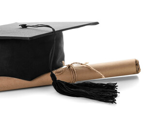 Graduation hat with diploma on white background