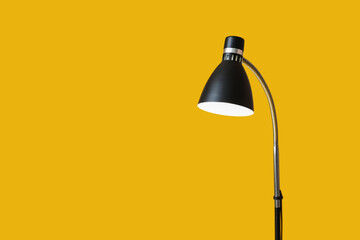 Modern lamp on color background