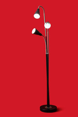 Modern lamp on color background