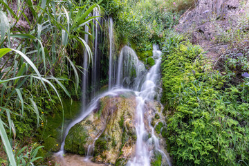 Fototapeta na wymiar Water cascades in the Algar river, in Callosa d'en Sarrià, in Alicante (Spain).