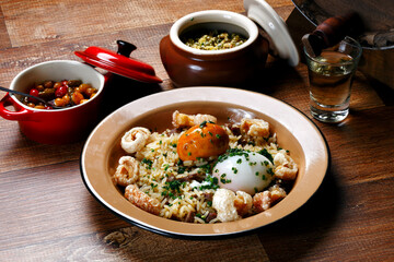 Rice with Pequi, crackling and boiled egg
