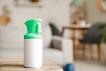 Bottle of air freshener on table in living room, closeup