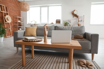 Fototapeta na wymiar Stylish interior of living room with cozy sofa