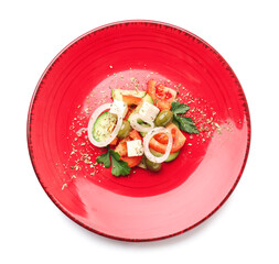 Plate with tasty Greek salad on white background