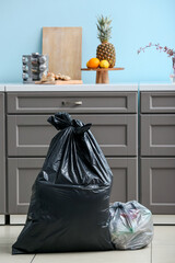 Bags with different garbage at home