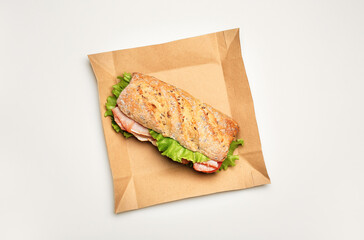 Tasty ciabatta sandwich on white background