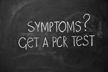 PCR - Polymerase Chain Reaction. Chalkboard lettering get a PCR test