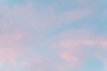 beautiful cloudy sky of pink and sky-blue soft color. background of the sunset sky in pastel colors