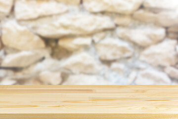 wood table top on blur stone wall background