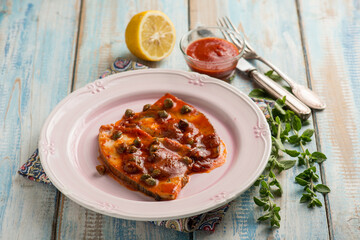 sword fish with tomato sauce caper and fresh oregano - obrazy, fototapety, plakaty