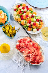 Cucumber and melon salad with raspberries and Prosciutto with grilled peppers