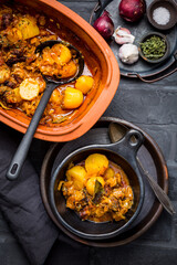 Goulash with potatoes and sauerkraut. Beef and vegetable stew in clay pot