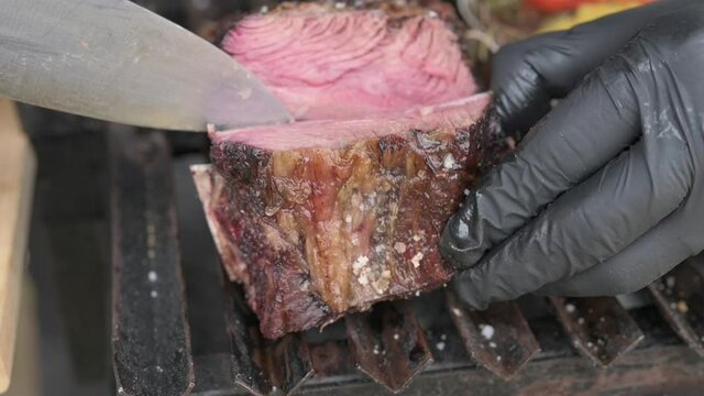 Grilled with rib of beef, chistorra and sausages. Golden sausages ready for the celebration of the picnic. Charcoal grill concept.