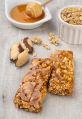 Homemade cereal bars with nuts, muesli, honey and copy space