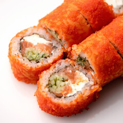 Inside-out Sushi rolls decorated with masago or tobiko caviar. Sushi Set. Close up shot. Classic Japanese food, Oriental cuisine. Top side view. Soft focus.