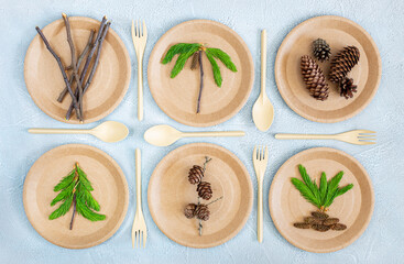 Served table with disposable tableware with natural materials. Eco-concept, recyclability, biodegradability, plastic free. Caring for nature. Preschool education, crafts with children. Flat lay.