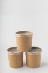 Non-plastic cups for soup delivery on white background