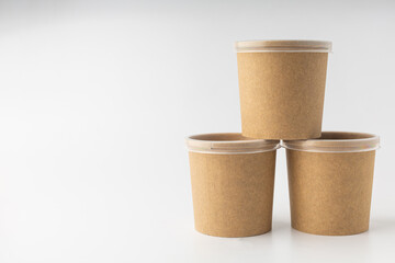 Non-plastic cups for soup delivery on white background
