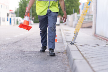 young technician at work marking work area