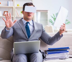 Businessman with virtual reality glasses in modern technology co