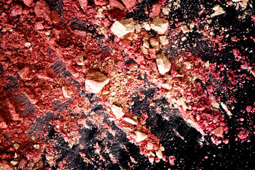 Crushed cosmetics, mineral organic eyeshadow, blush and cosmetic powder isolated on black...