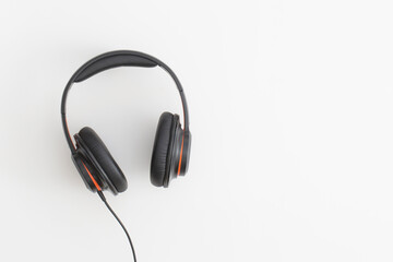 Headphones on white background. Music concept. Flat lay composition. Top view.