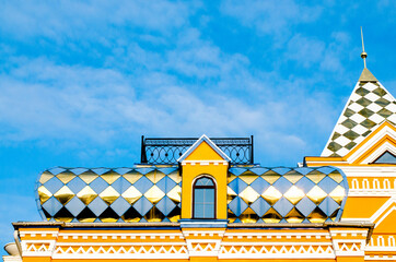 Part of the golden mosaic roof. Blue sky