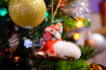 A small hand-sewn squirrel-shaped Christmas tree decoration.