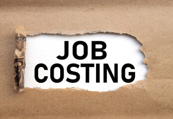 JOB COSTING.text on torn cardboard. black letters on white paper