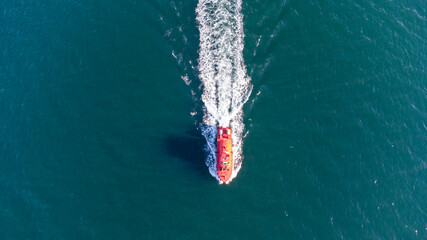 Pilot boat at sea in the port water area. Aerial view.