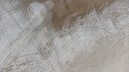 The bottom of a dried up salt lake. View from the air. Traces of cars and motorcycles in the sand.