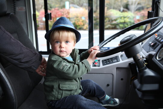 Cute Blonde Boy, Toddler, 'Driving' a Bus, Autumn, Nature Park