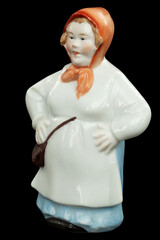 Porcelain figurine of a woman, the fisherman's wife, isolated on black background