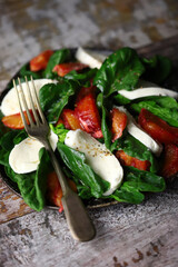 Fitness salad with spinach, mozzarella and orange. Super salad.
