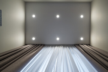 suspended ceiling with led diode spots lamps and drywall construction in empty room in apartment or...