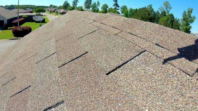 Roof shingle damaged during storm with high winds