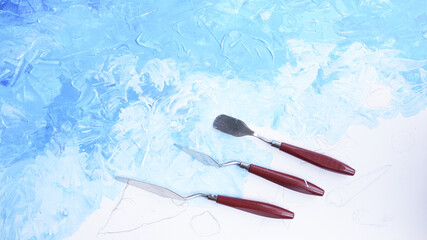 Ocean acrylic painting with palette knife on canvas with blue and turquoise as sea water and wave with trowel texture technic. Water splash art hand paint.  Summer and seascape.