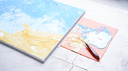 Ocean acrylic painting with palette knife on canvas with blue and turquoise. Golden sand on beach with trowel texture technic. Water splash art hand paint.  Summer and seascape feeling and tone.