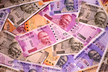 Indian paper currency rupees as a background.