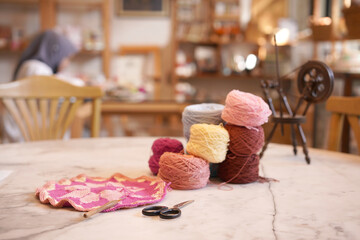 Crochet thread in group as many colors in studio of handicraft school as background. Needles craft on table for hand made hobby.Crochet yarn bag with cotton yarn.