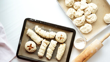 Whole wheat bread from homemade whole grain dough made by woman with red apron. Healthy pastry with many grains.