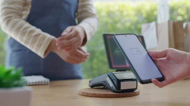 Mobile phone contactless paying cashless e-wallet digital payment.