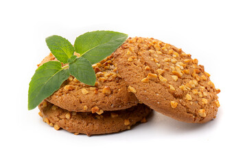 Oatmeal cookies with a green mint leaf on a white background. Diet food.